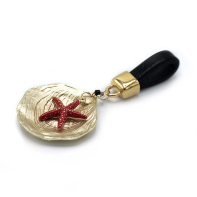 Hanger Gouden schelp met rode zeester